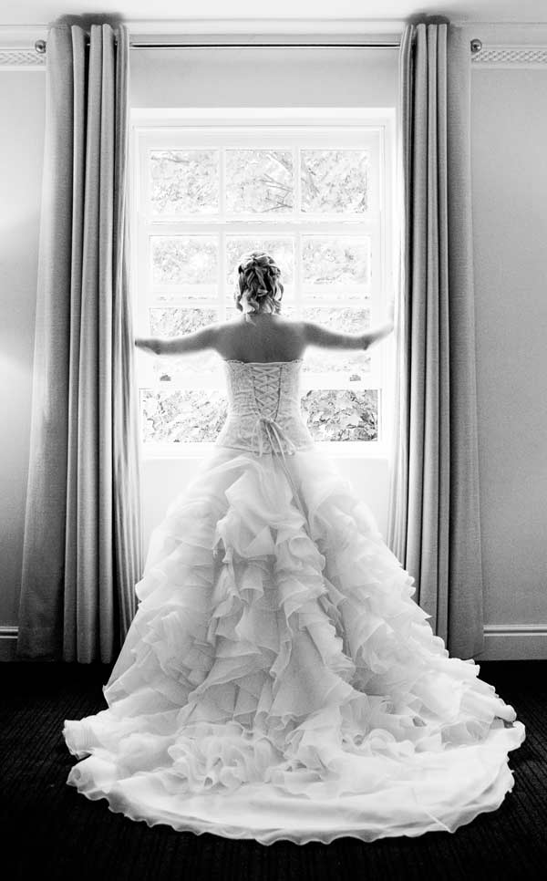 Bride looks through Sopwell house photo