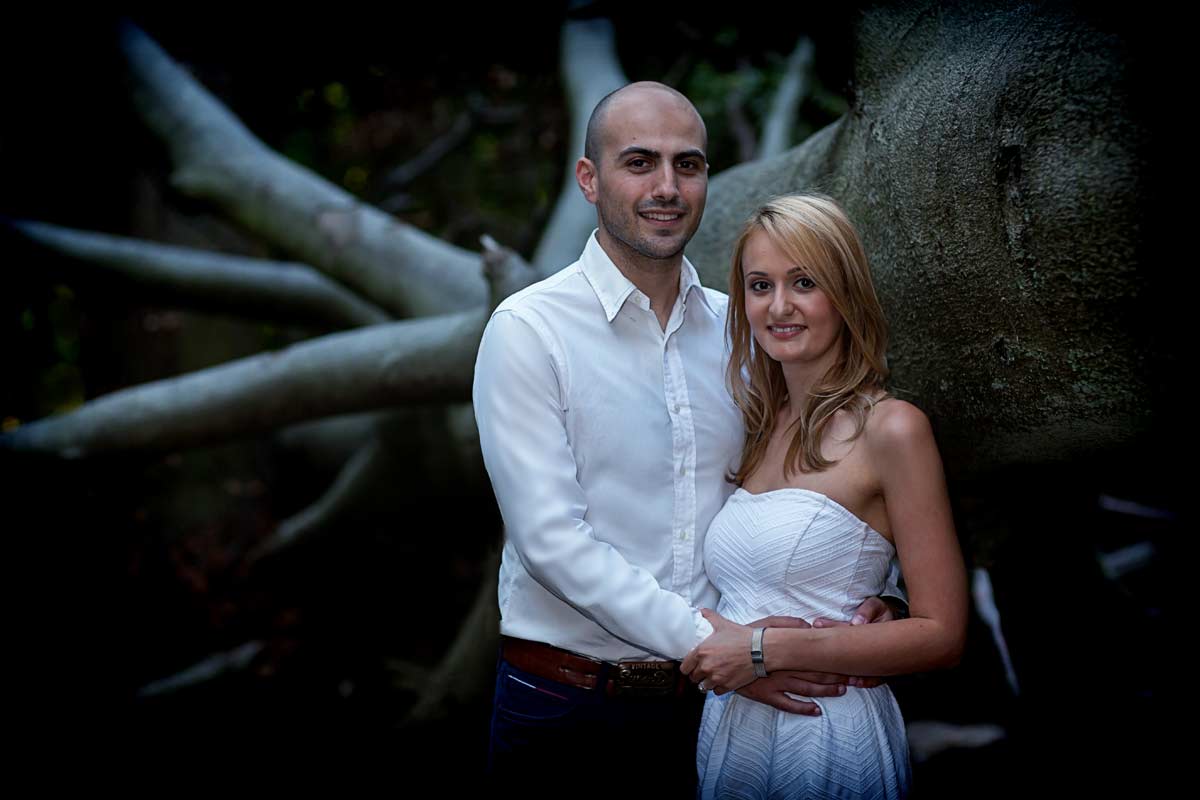 couple by tree in London engagement shoot