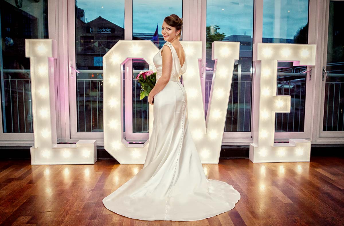 Bride by Love sign light at Camden wedding Holiday Inn