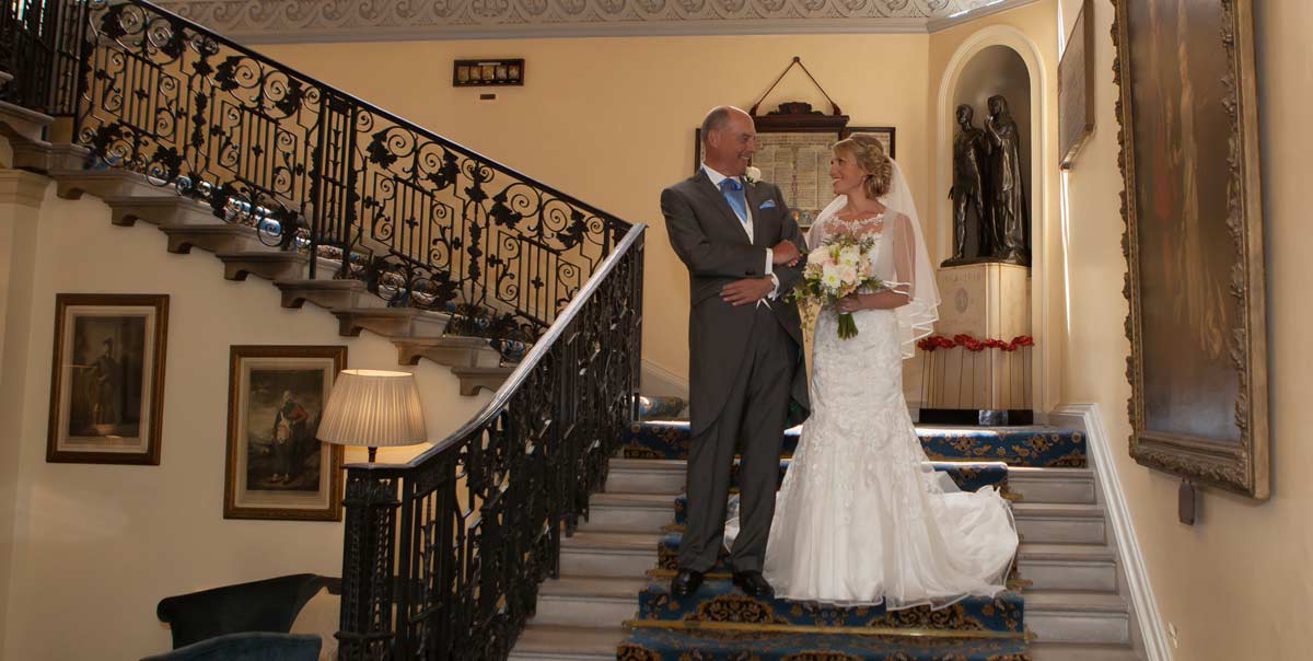 Bride on stairs of London Caledonian Club
