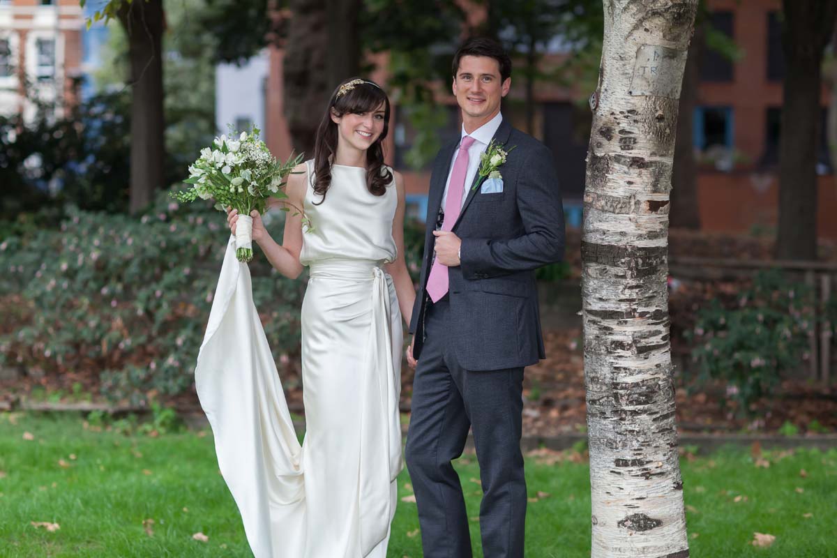 Wedding couple in grounds os Shoreditch church