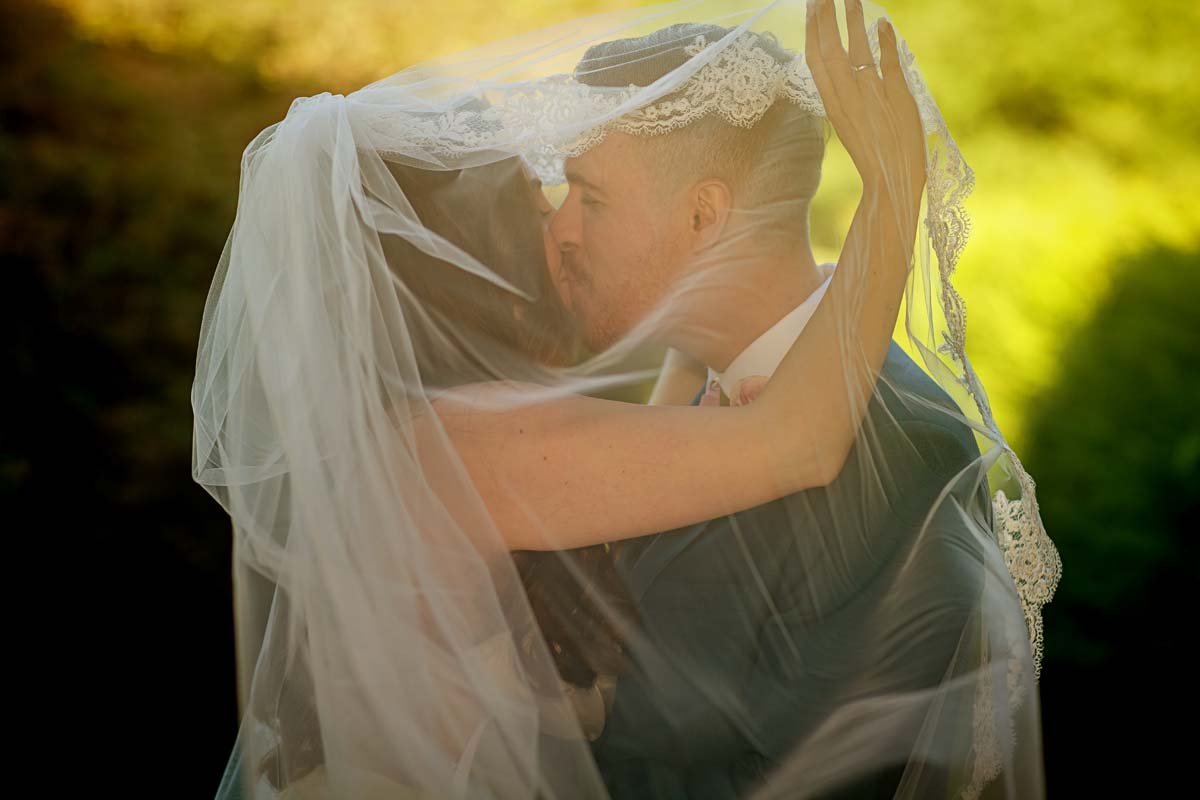 couple under veil Offley wedding
