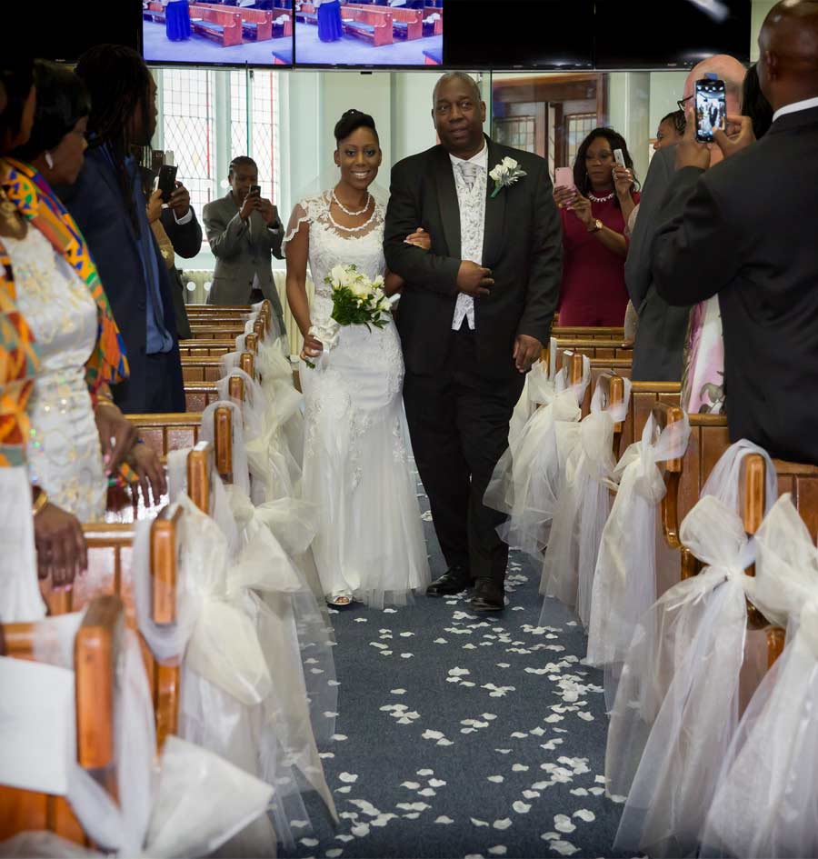 Bride comes down the aisle in London church