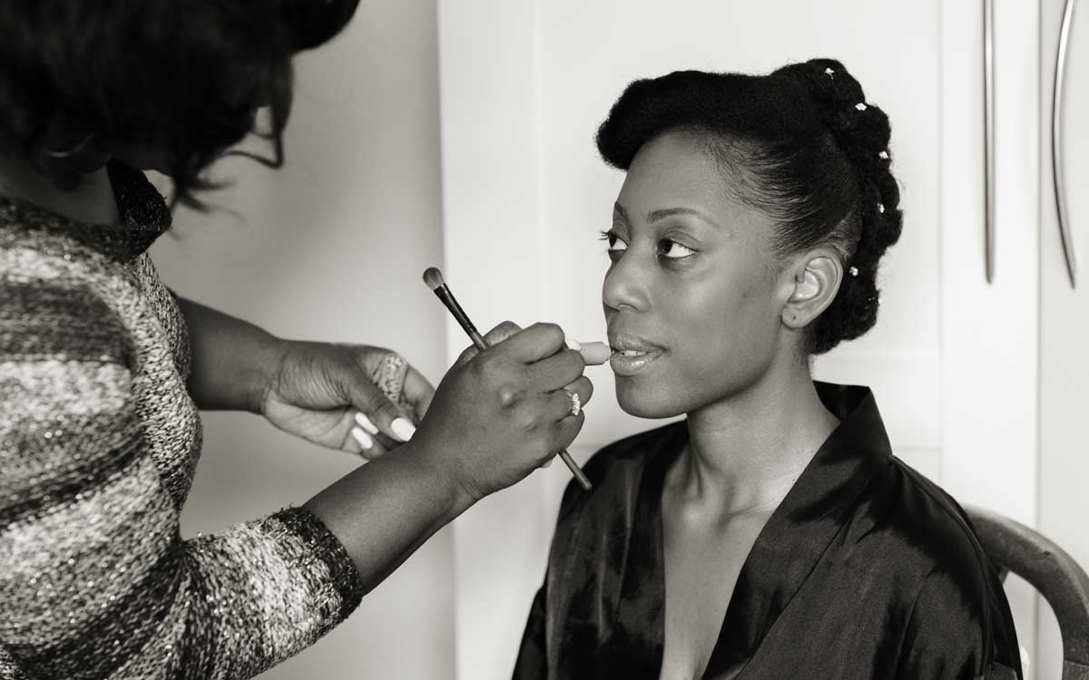 Makeup being applied to bride before her London wedding day