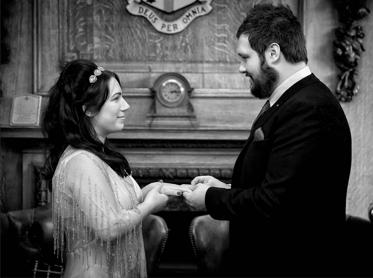 Photo of exchanging of wedding rings at Islington Town Hall