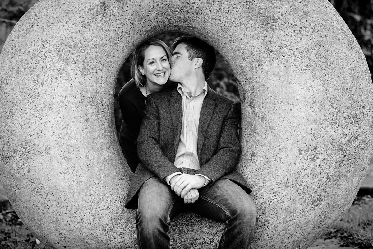 London based couple kiss inside stone circle photo