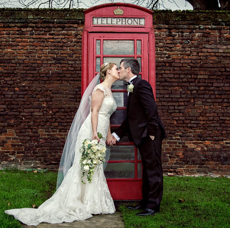 Phone box kissing shot outside Hampton Court Palace