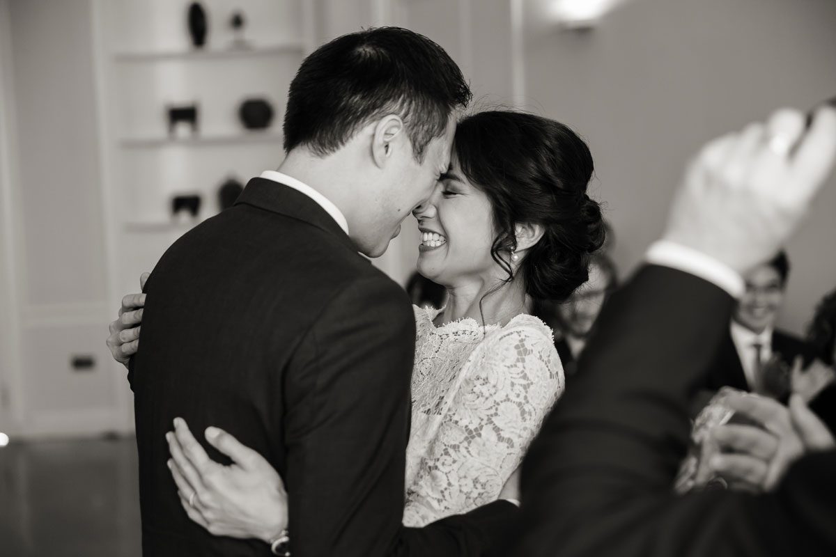 Hugging during wedding ceremony at London's Asia House