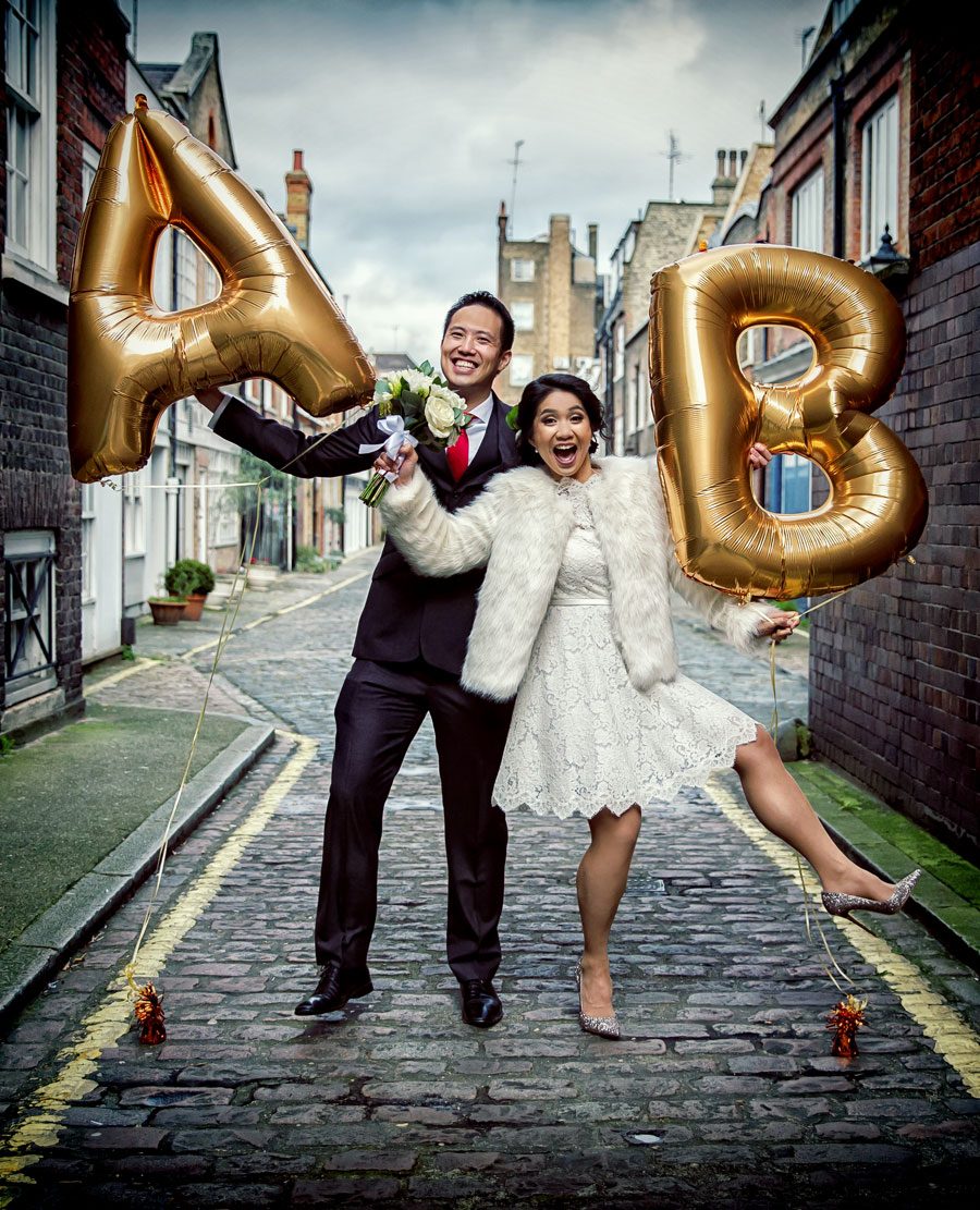 couple with balloons on their central London wedding day