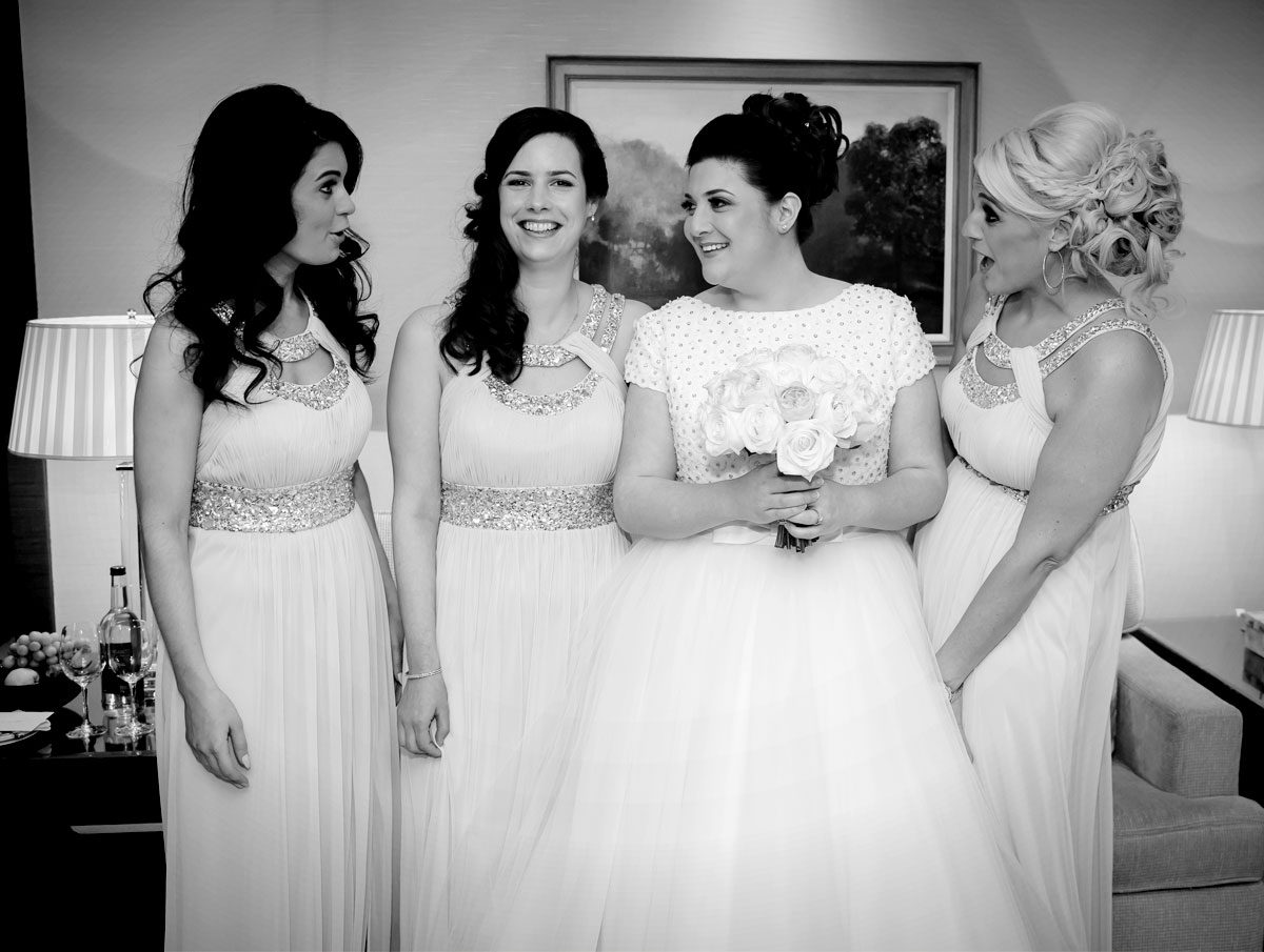 Bridesmaids laughing at Four Seasons Hotel wedding photo