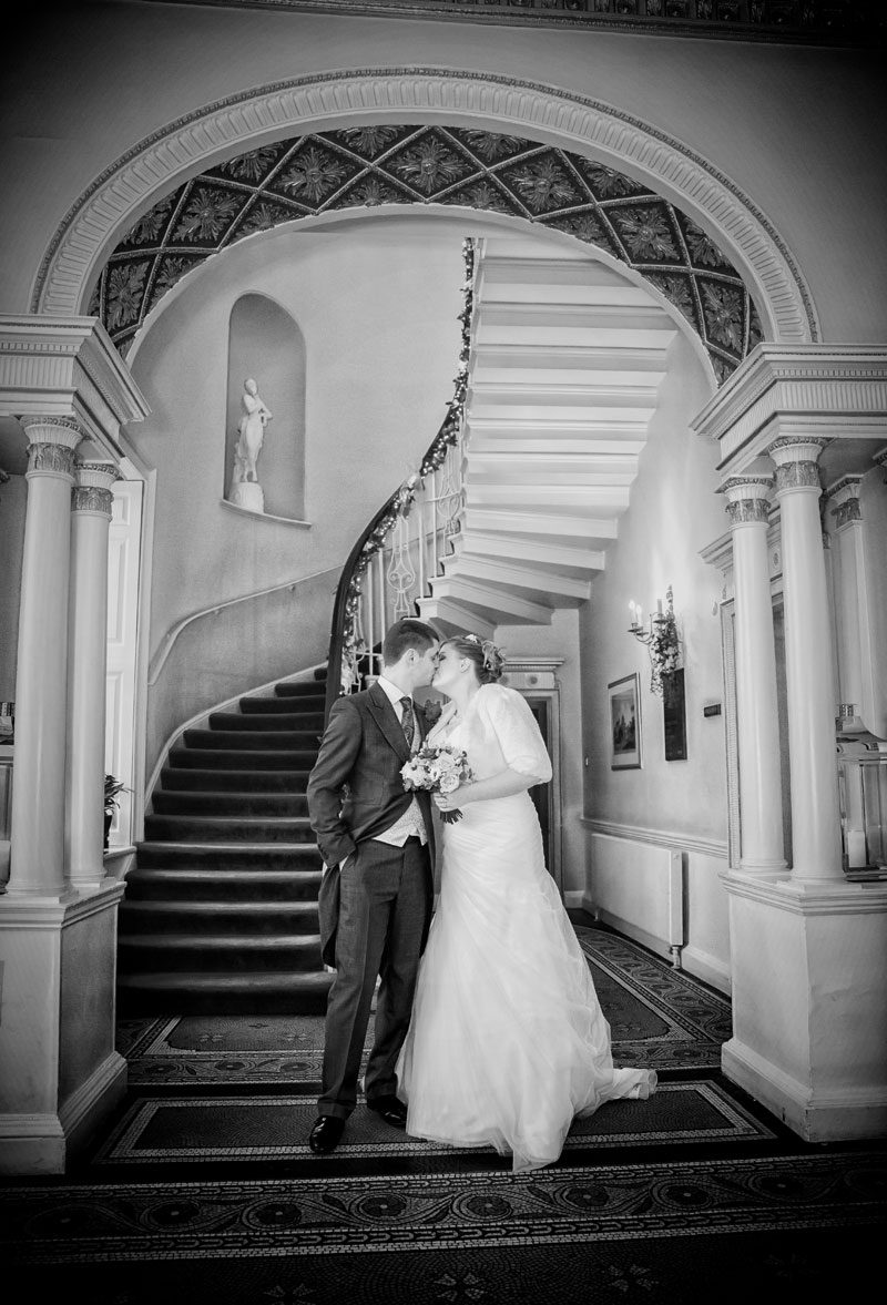 wedding couple kiss in Theobalds Park reception