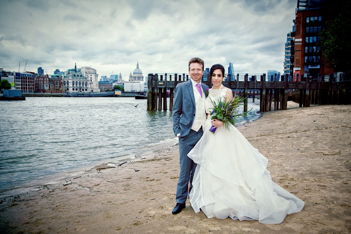 Couple on south bank beach after London Oxo Tower wedding