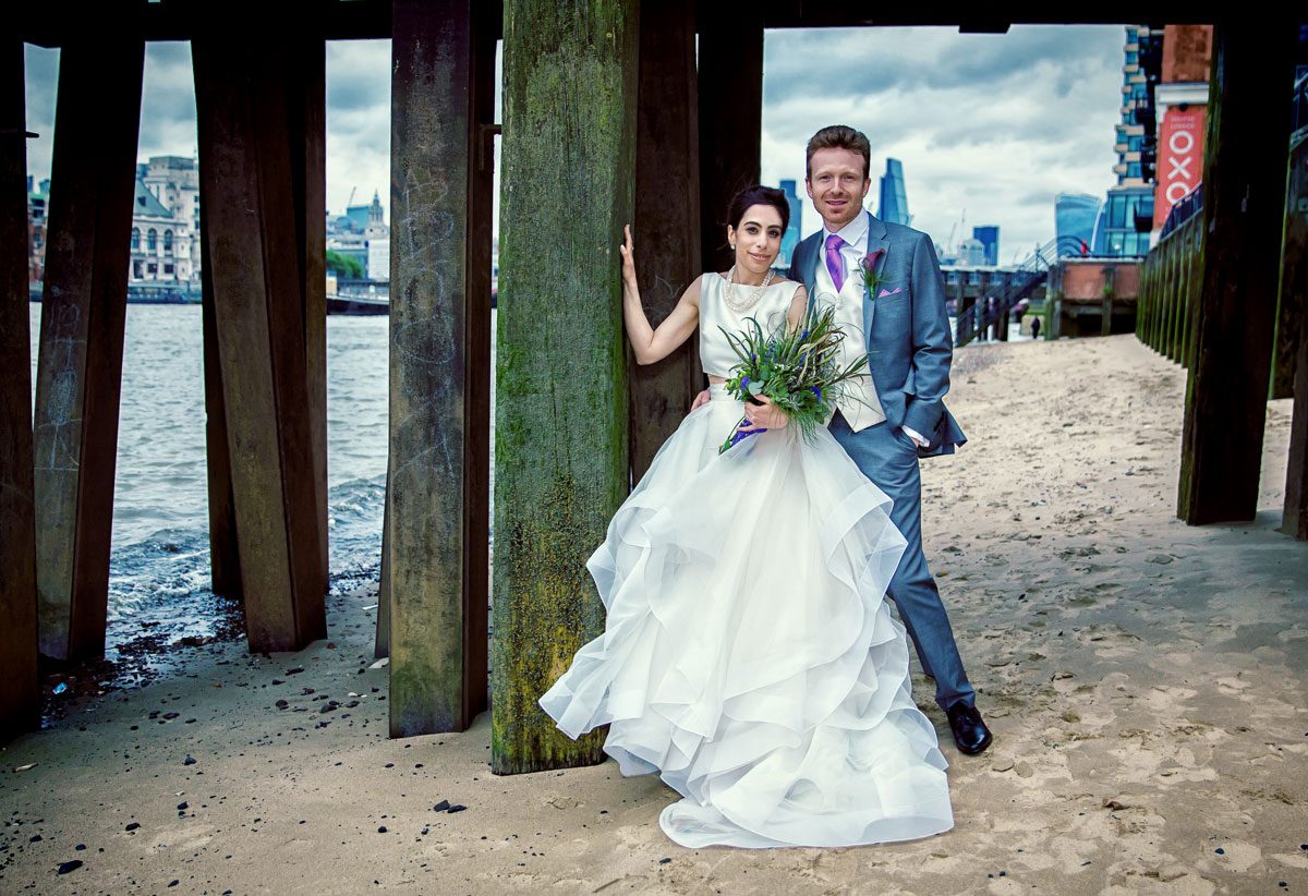 Wedding couple on the beach Oxo Tower London crop