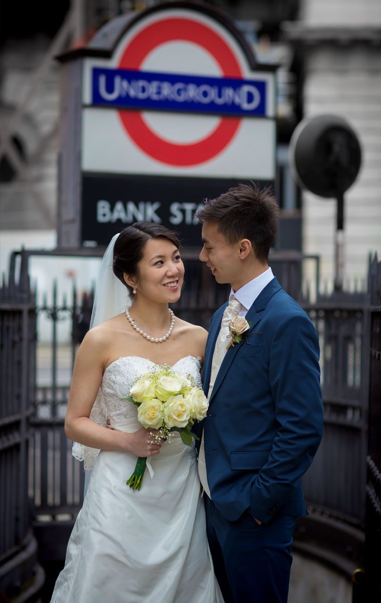Wedding couple stand by Bank Station