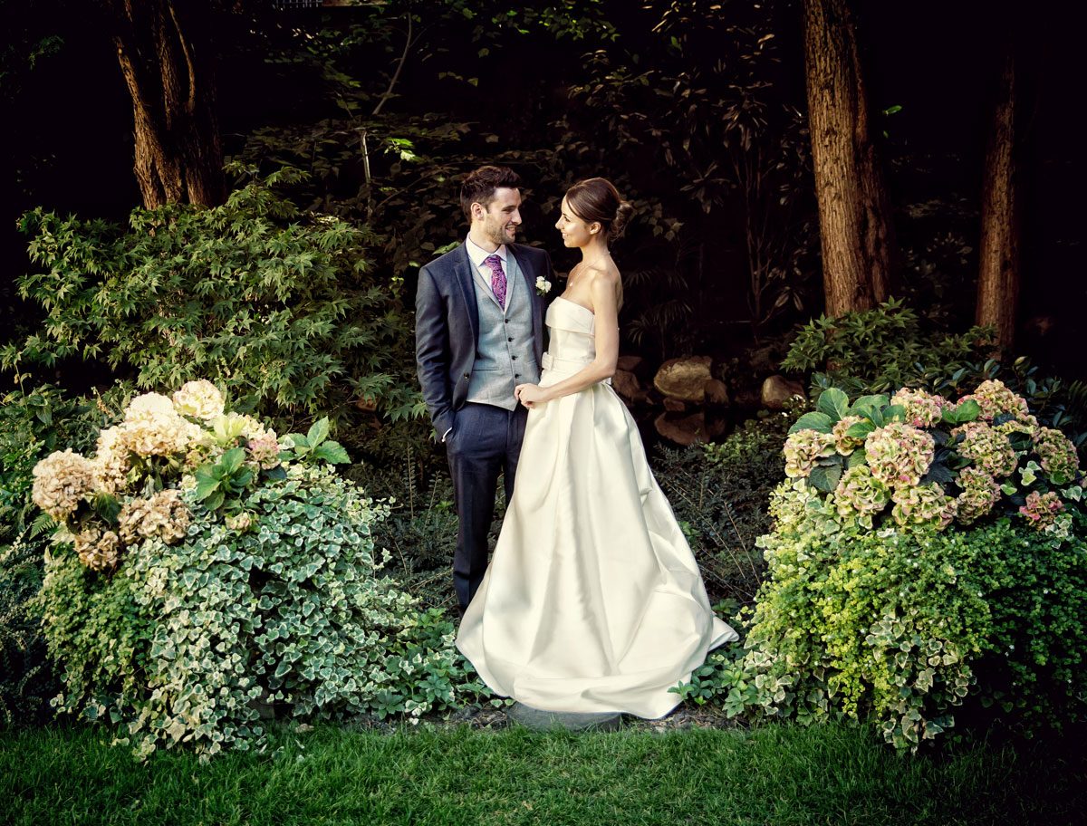 Goring Hotel Wedding Photographers couple in garden image