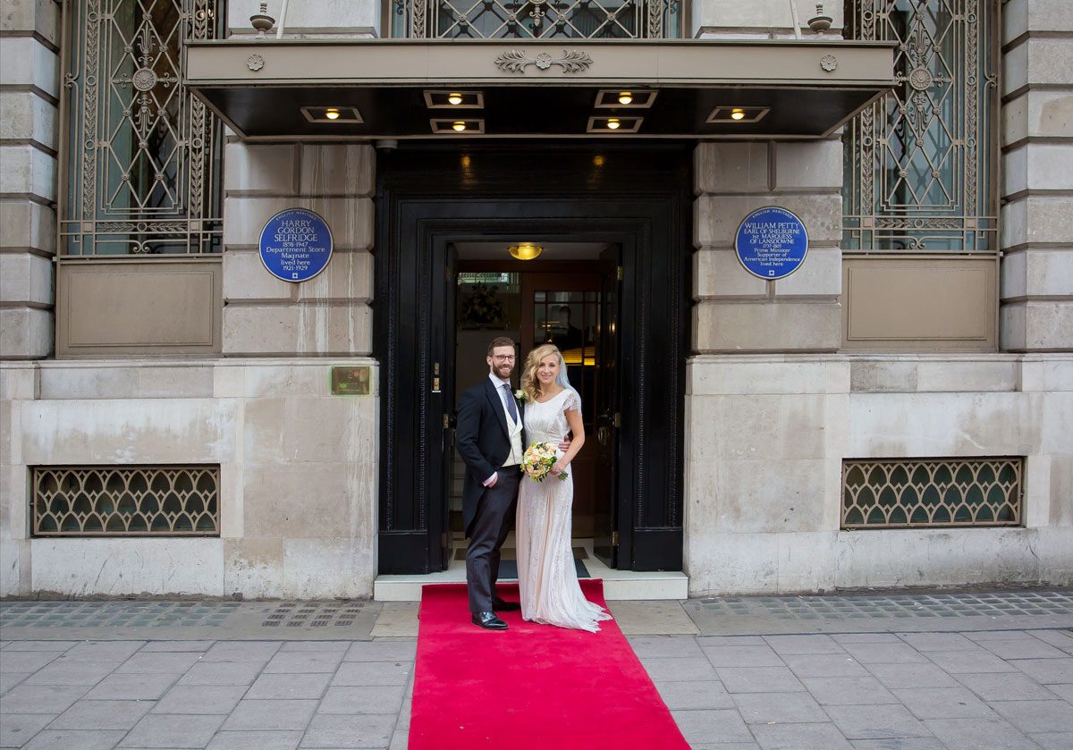 Lansdowne Club wedding couple pose outside entrance