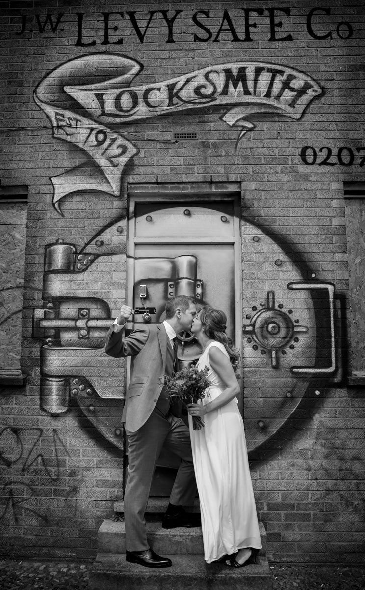 wedding couple by grafitti at east London wedding dat