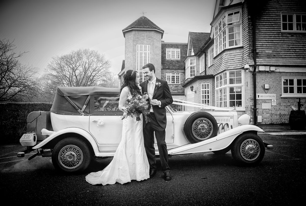 Couple and wedding car at Grovefield House wedding