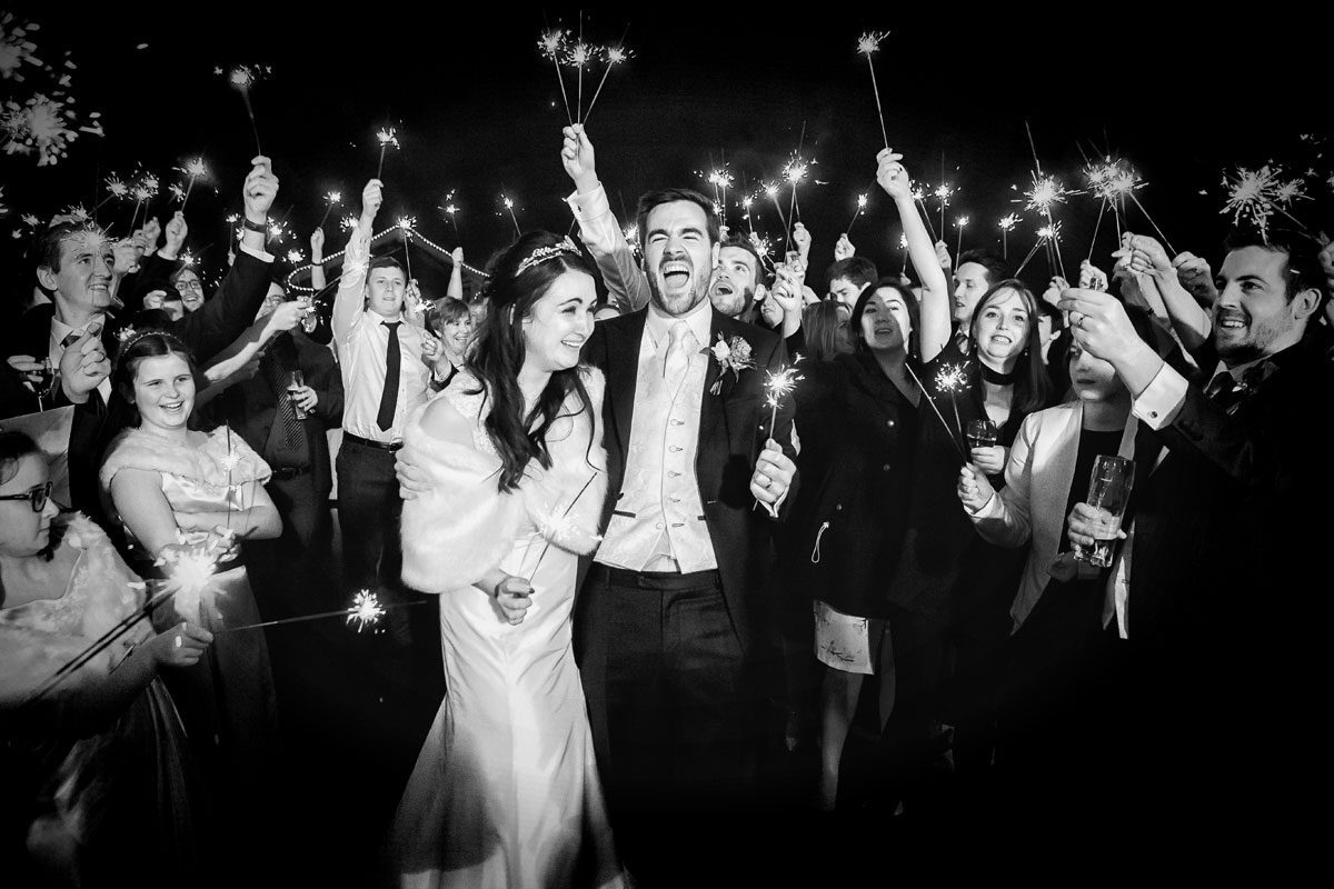 Fun with sparklers photo at London wedding