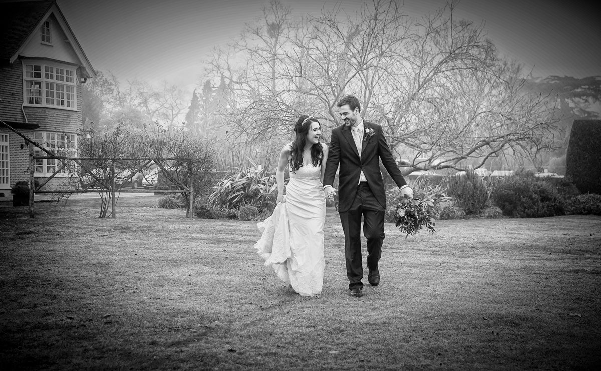 Wedding couple walking at Grovefield House Windsor
