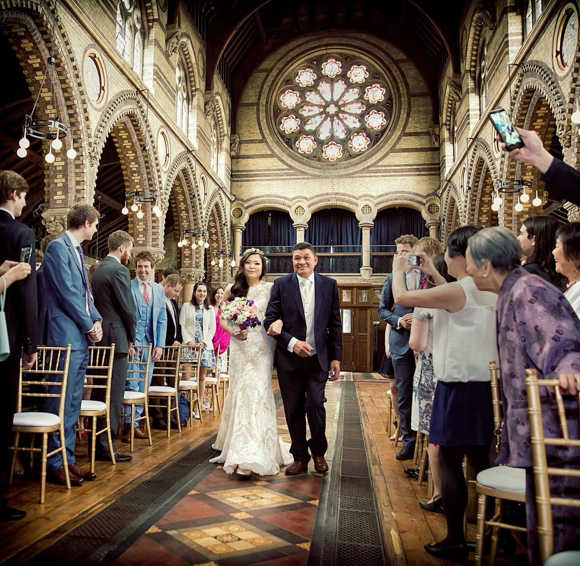 Bride-walks-down-the-aisle-at-Hampstead-wedding