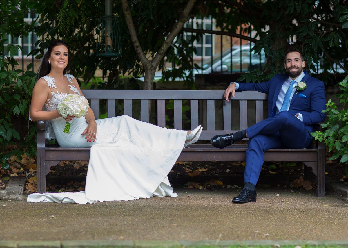 Chelsea Old Town Hall wedding bride and groom on a bench photo