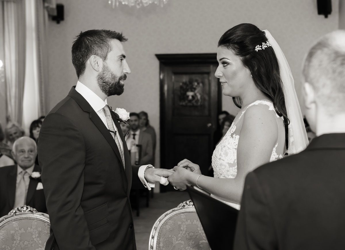 Exchange of rings at Chelsea Town Hall wedding ceremony