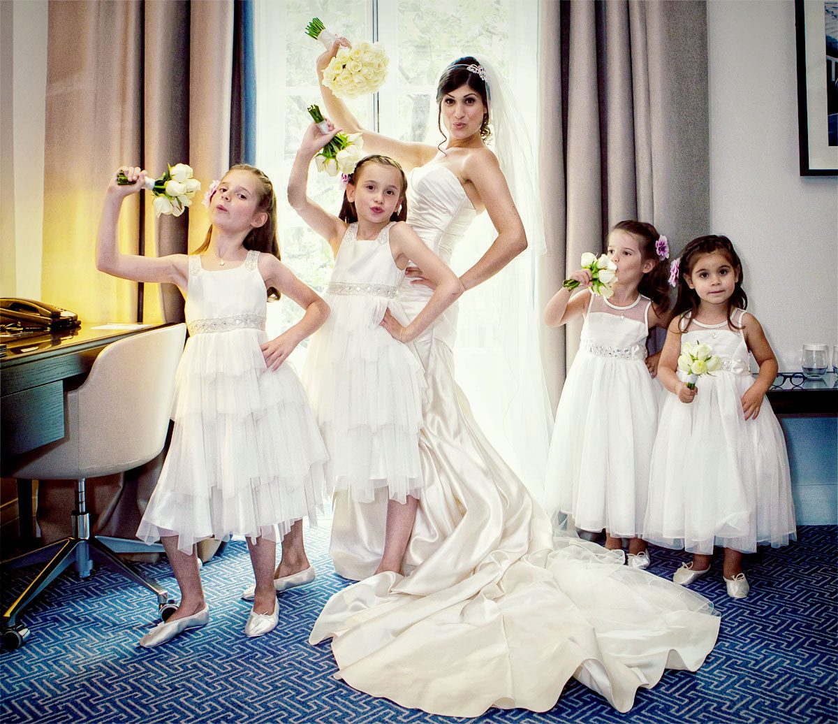 Bride and flower girls pose at Waldorf Hilton Hotel wedding