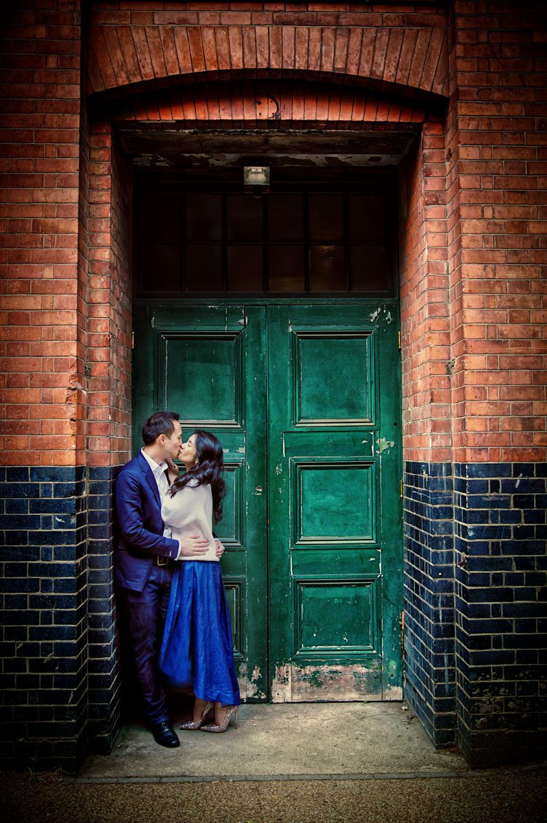 Engagement couple kiss in doorway London Southbank