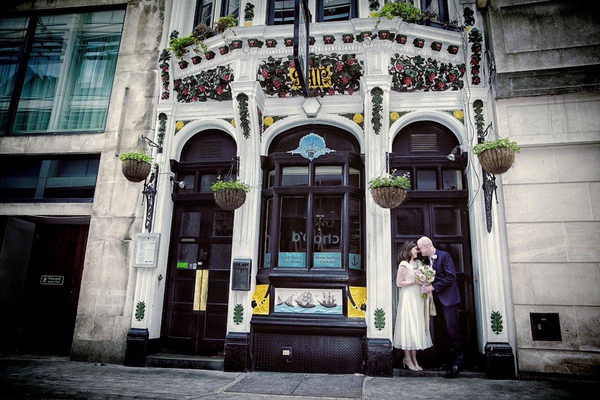 Wedding couple in pub doorway central London