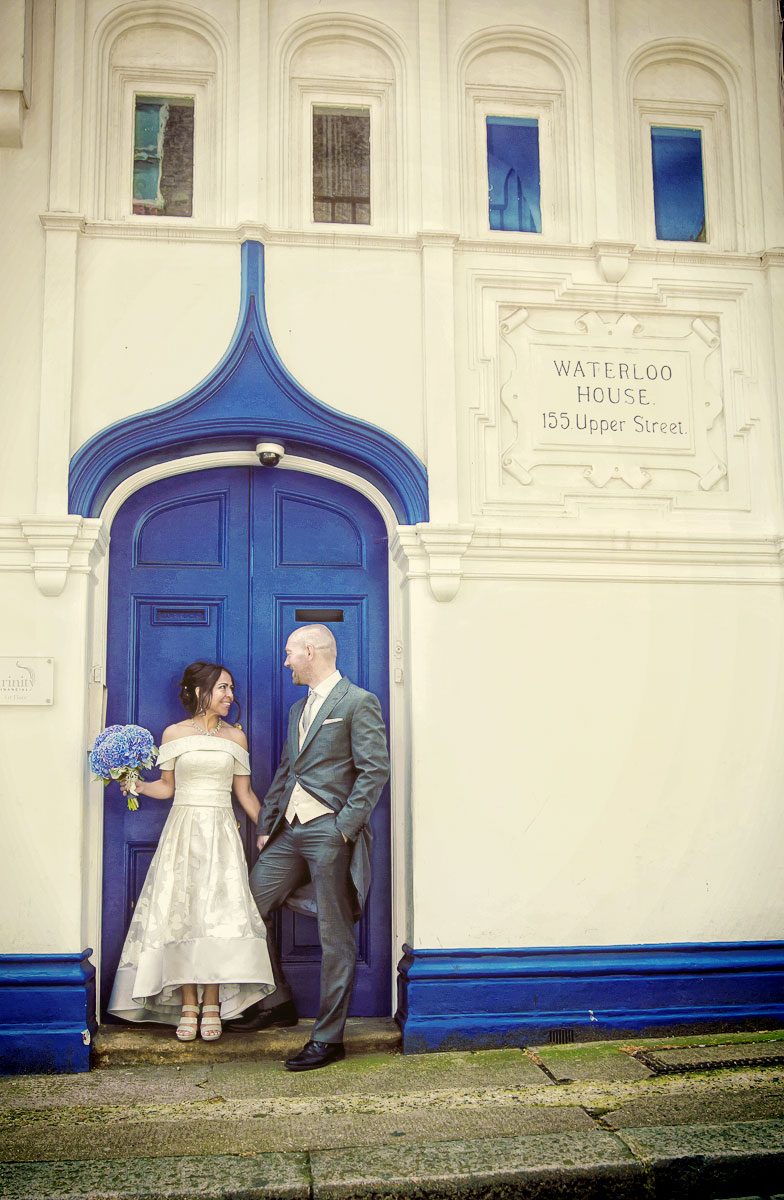 Islington wedding couple by blue door Upper Street