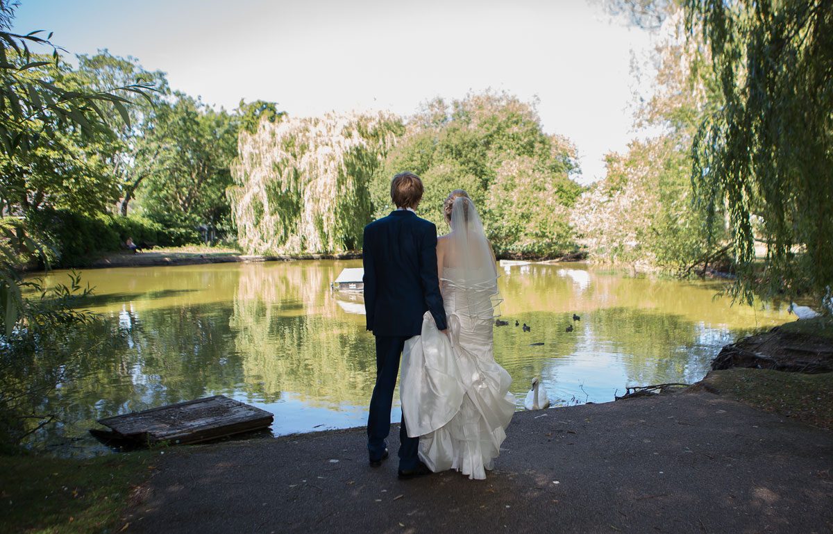 Barnet wedding couple look across lake image