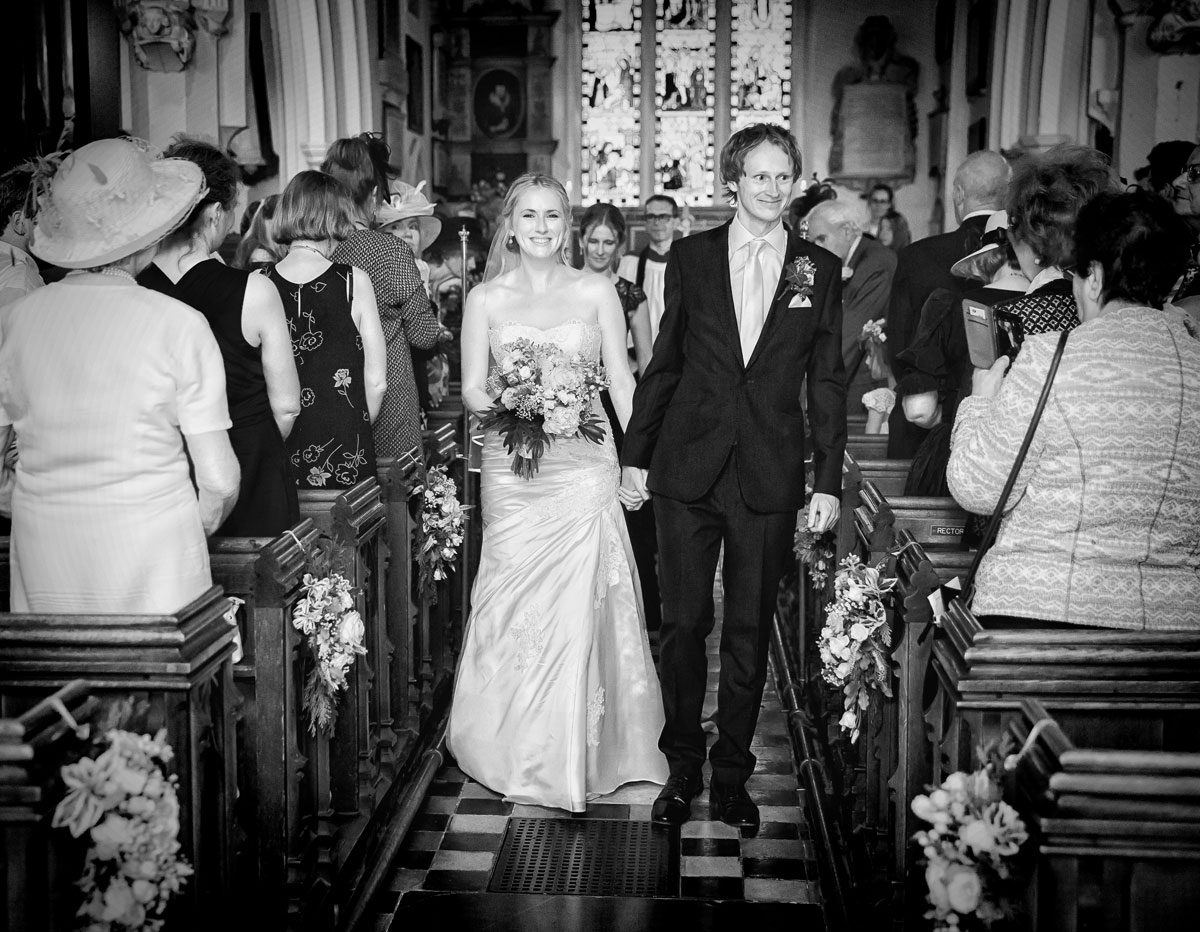 Bride and groom church recessional at Barnet wedding