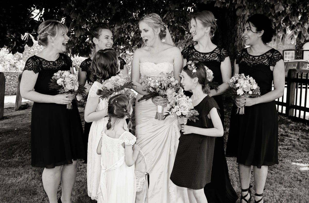 Bridesmaids laugh together at Barnet Church wedding