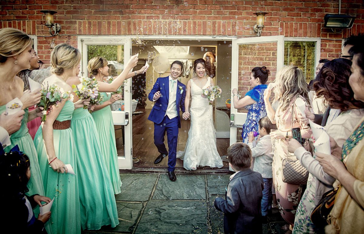 Confetti and bubbles at Stoke Place wedding day