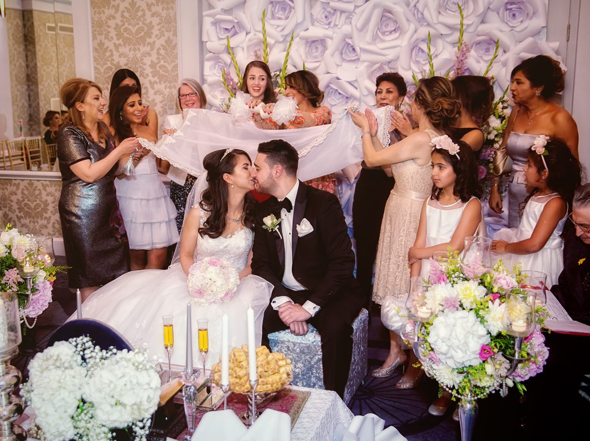 Persian wedding kiss London Connaught Rooms ceremony