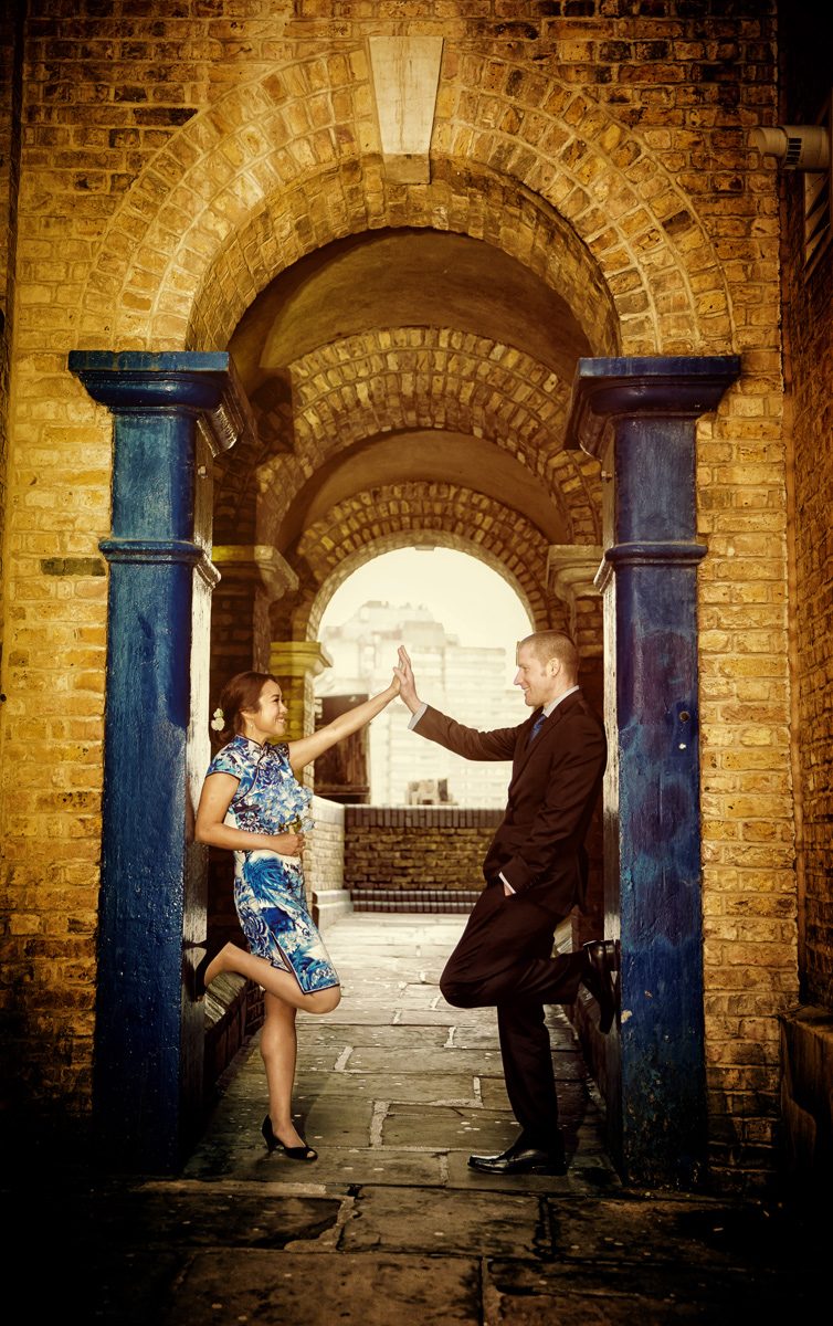 Engagement photo by arch at Londons Butlers Wharf