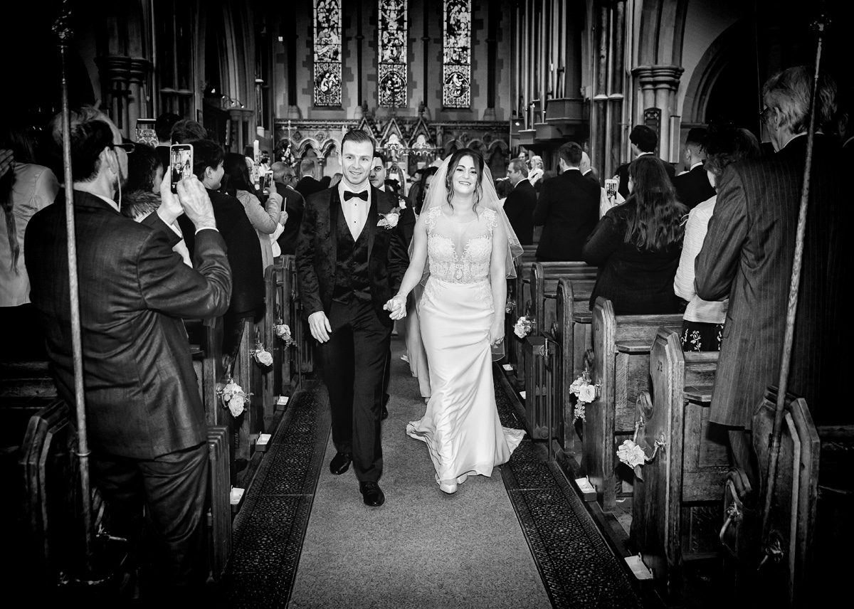 Wedding recessional bride and groom Christ Church Southgate