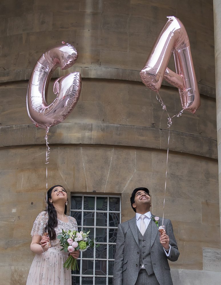 Langham Hotel wedding couple holding balloons