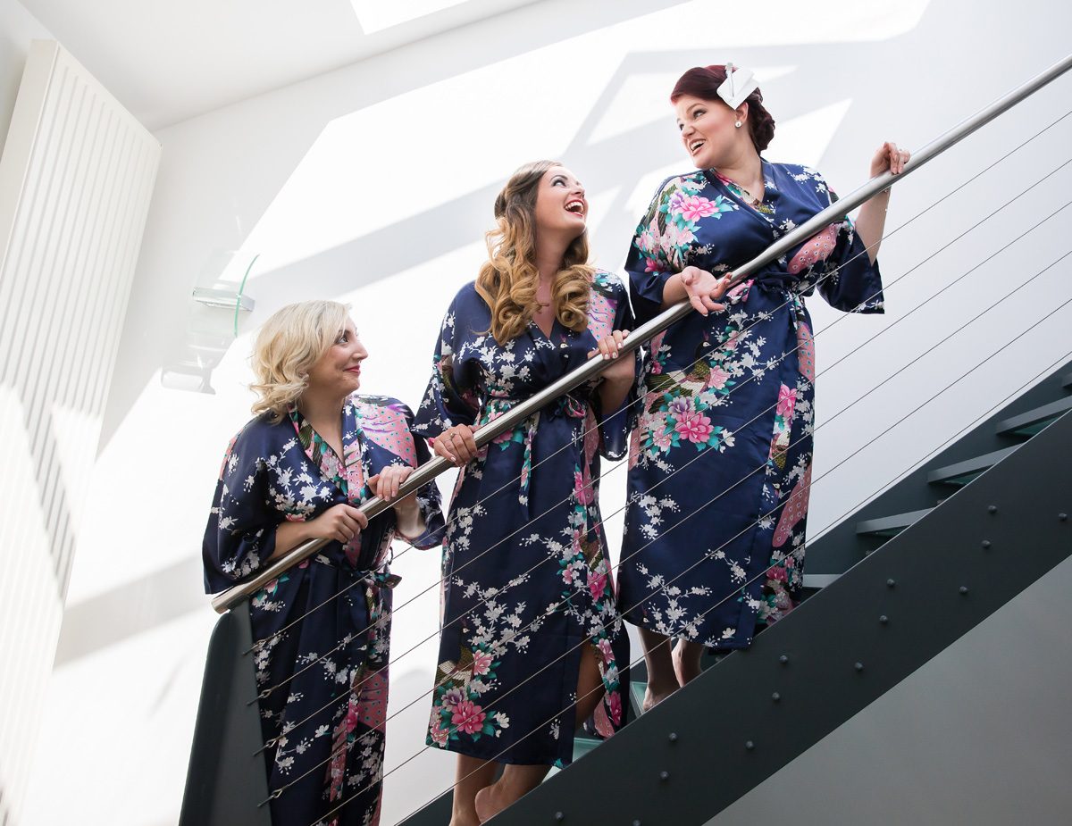 Islington wedding bridesmaids laughing on stairs