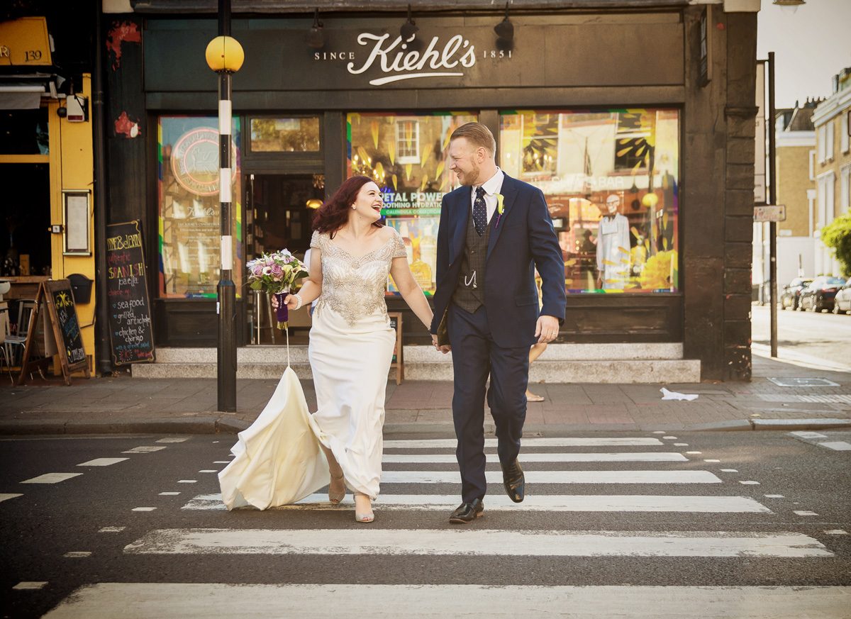 Islington wedding couple crossing Upper Street London