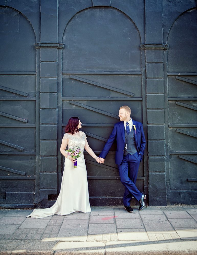 Islington wedding couple pose on Upper Street