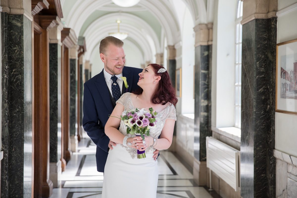 Wedding couple inside corridor Islington Town Hall