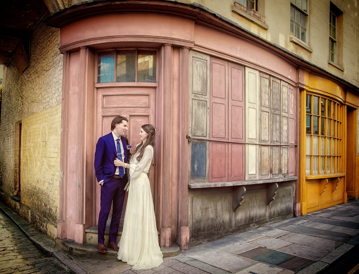 London wedding couple by old shops Bermondsey Tanner Warehouse