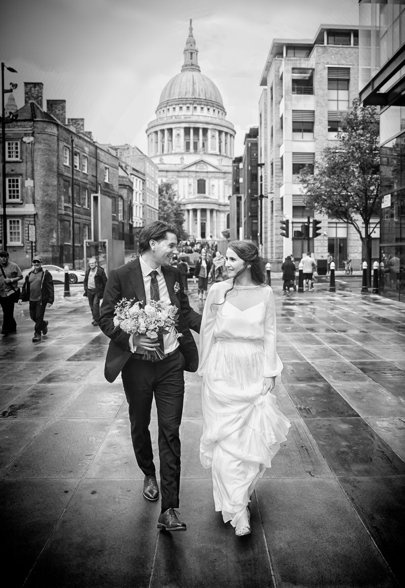 London wedding couple head towards the Millennium bridge
