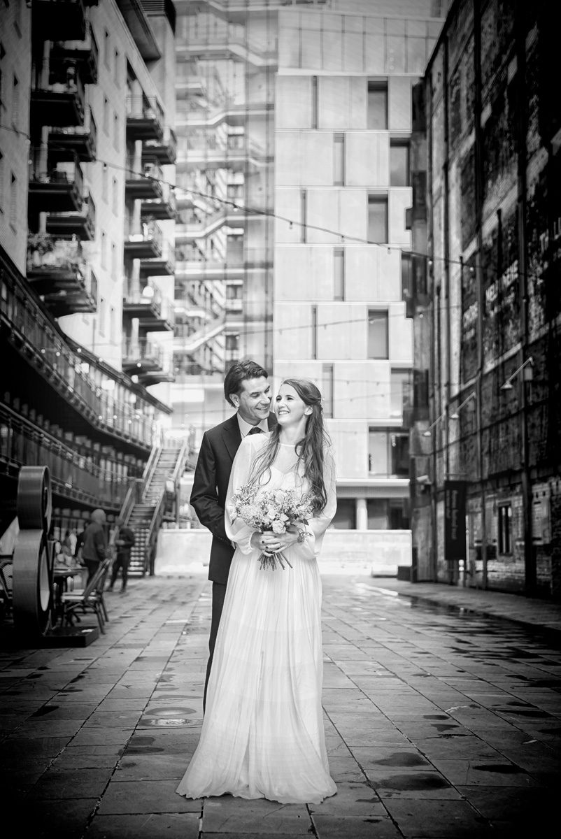 London wedding couple near Oxo Tower laughing