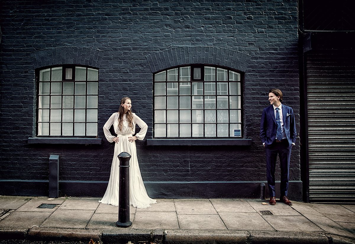 Tanner warehouse wedding couple pose in street