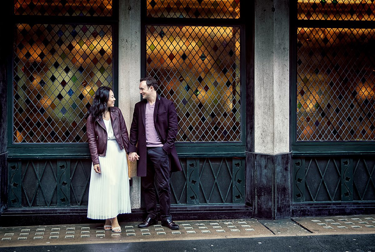 Outside the Ivy London engagement shoot couple hold hands