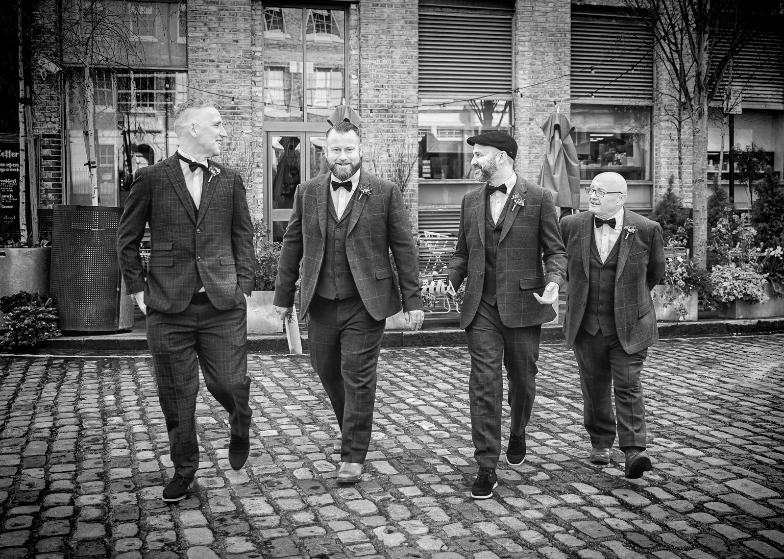 Groomsmen walking to Clerkenwell wedding day