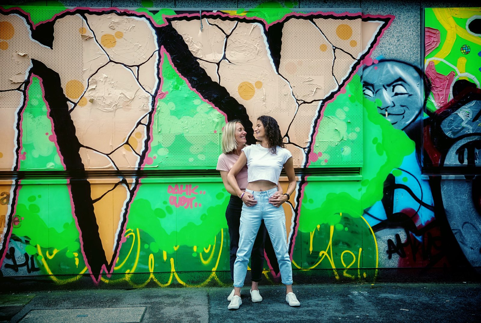 Shoreditch engagement shoot ladies by graffiti